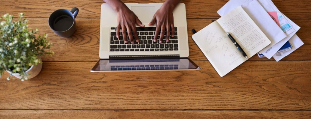 Hands typing on a keyboard - remote work for veterans